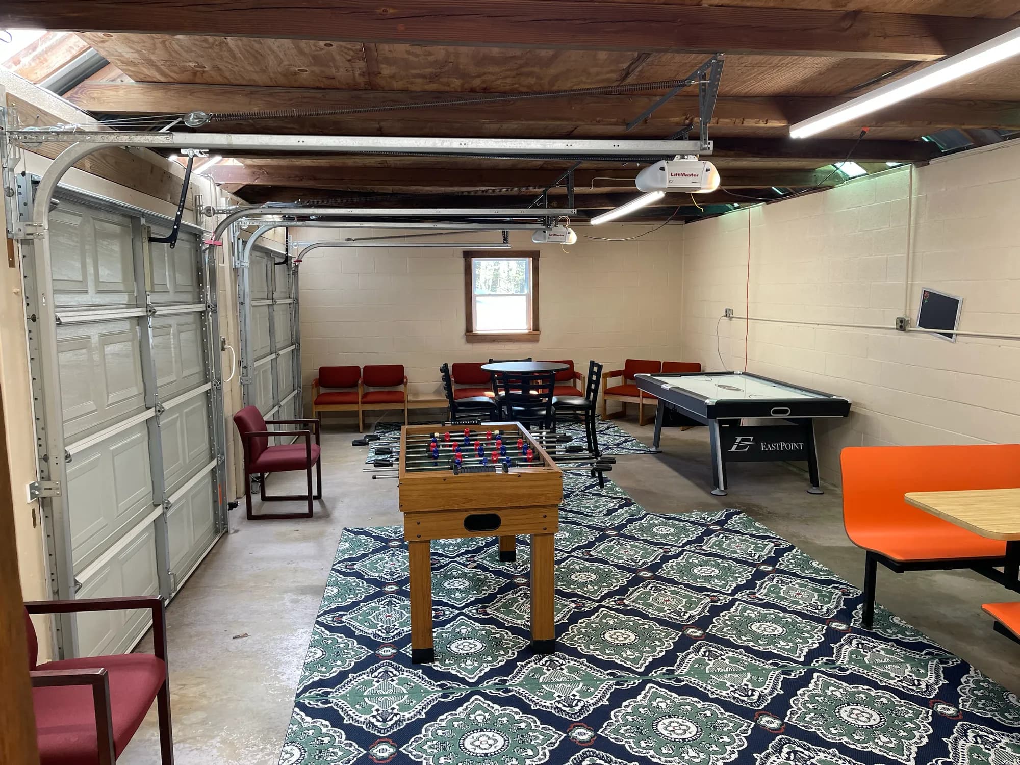 Game room interior with foosball and air hockey tables