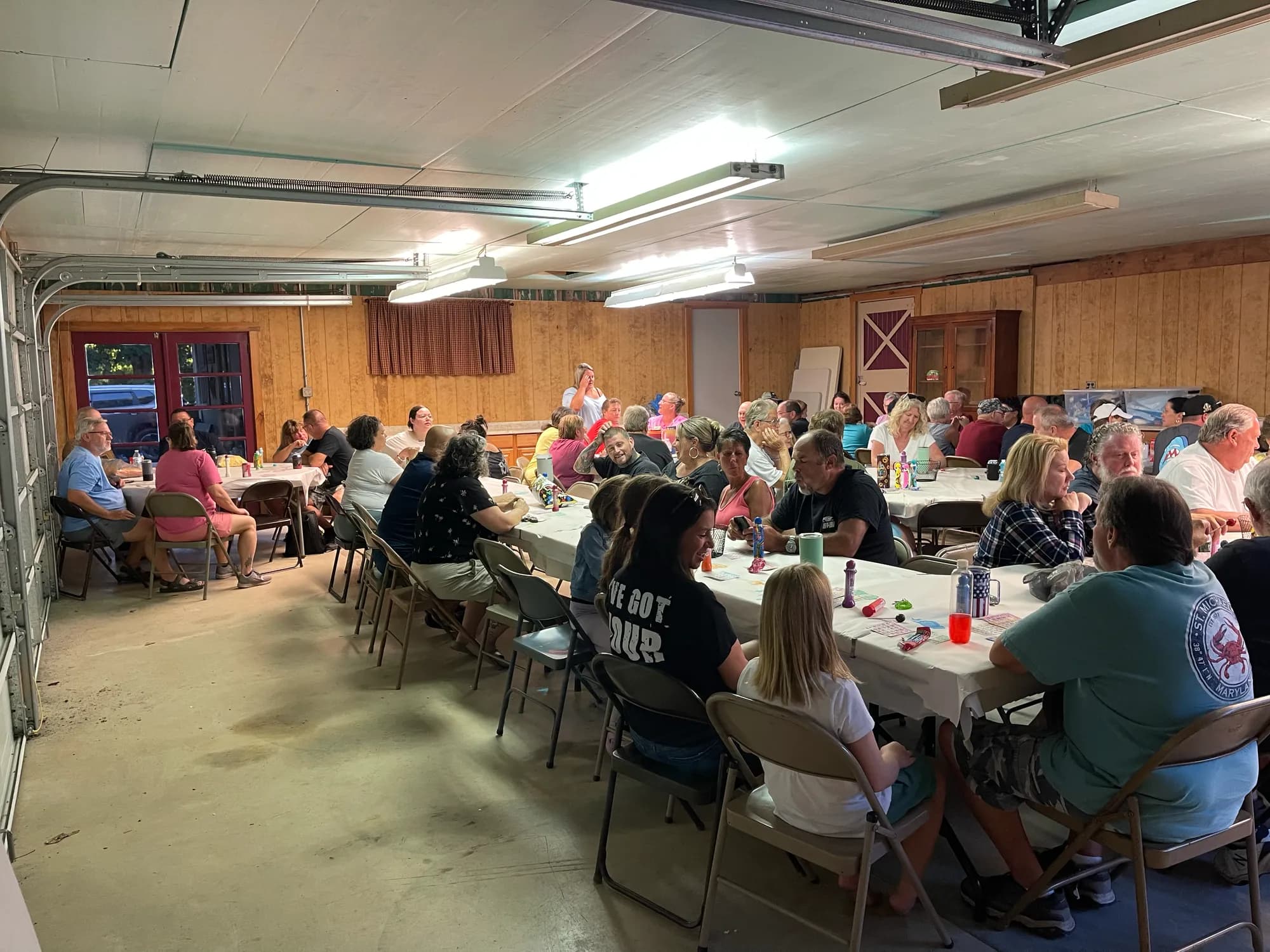 Campers gathered at long tables for a meal in the lodge