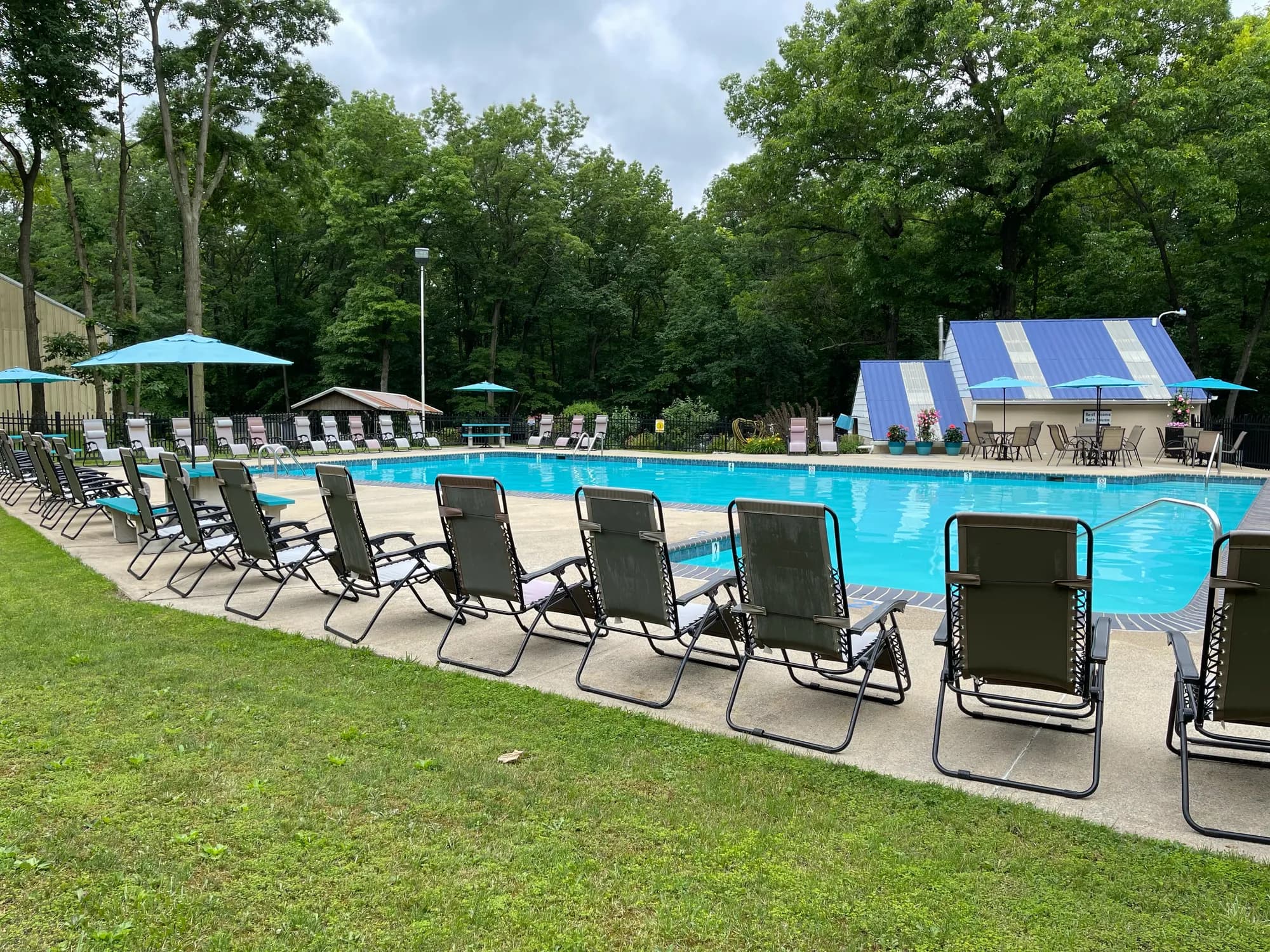 Rows of lounge chairs lining the swimming pool