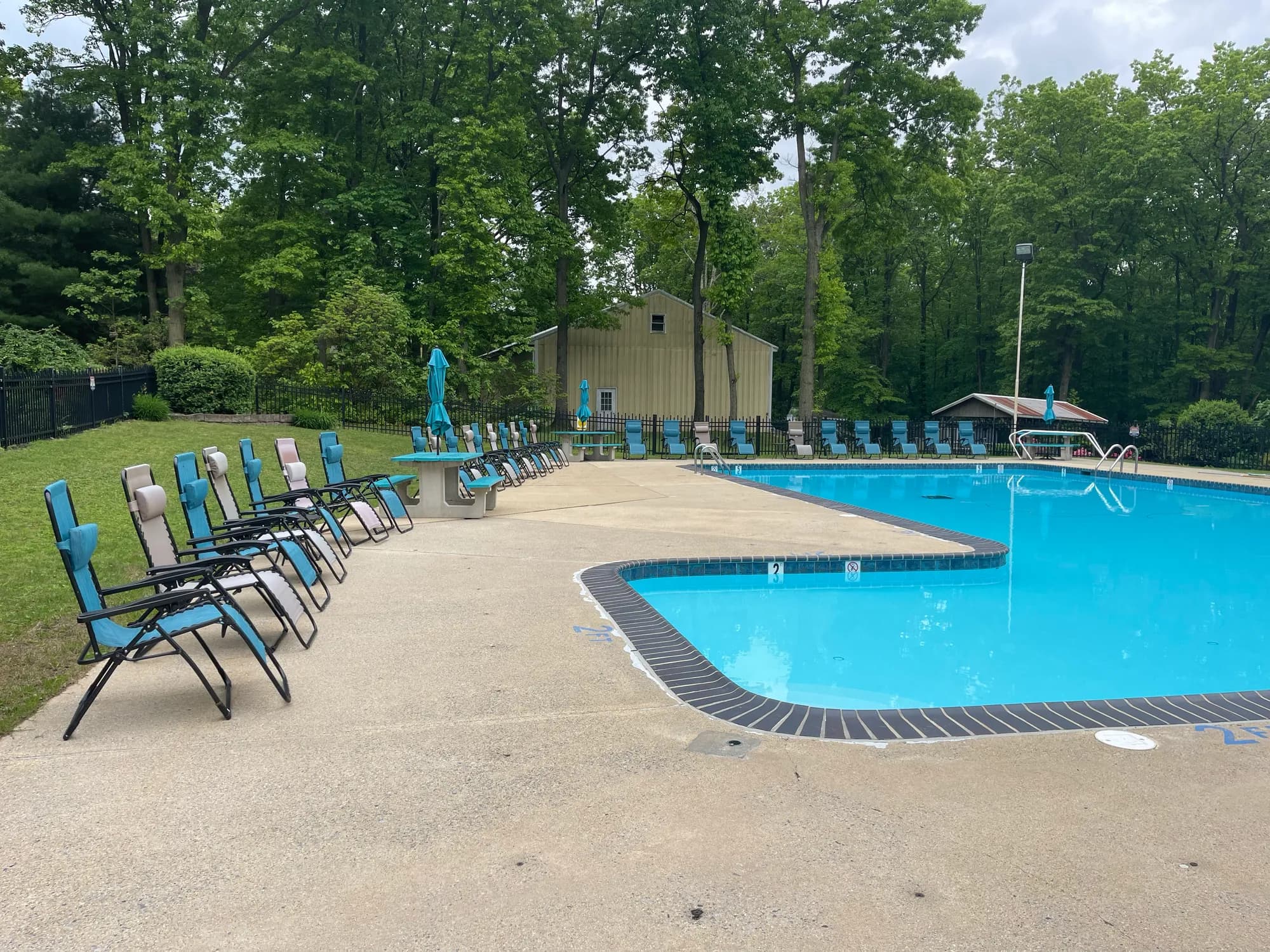 Lounge chairs on the deck beside the swimming pool