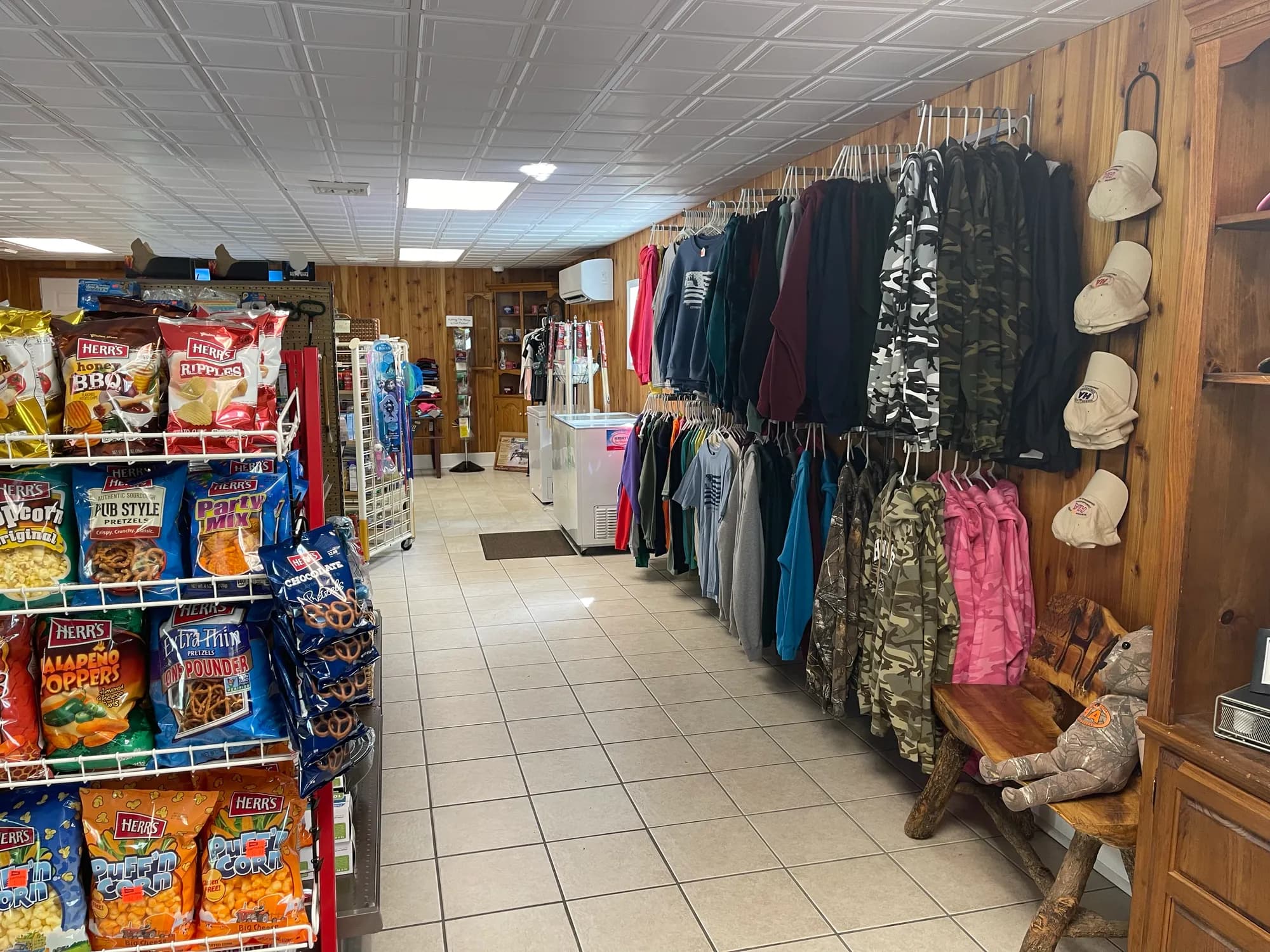 Snacks, apparel, and camp hats for sale inside the camp store